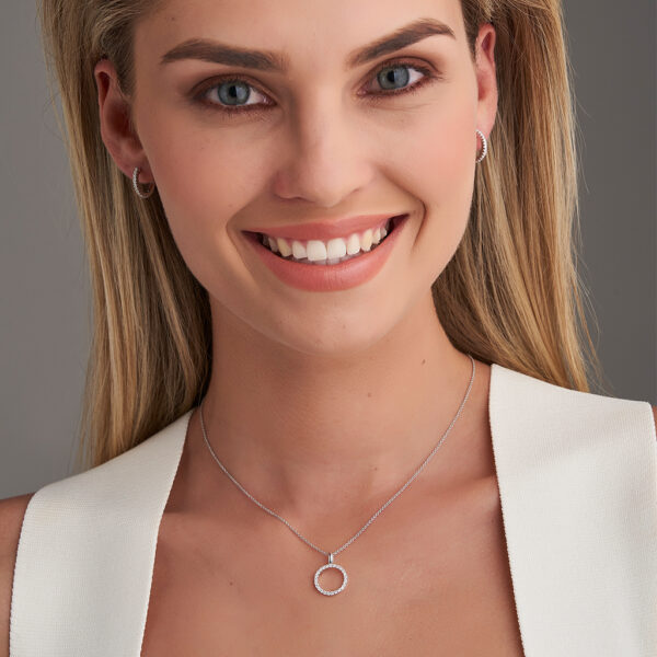 woman wearing white gold diamond circle pendant