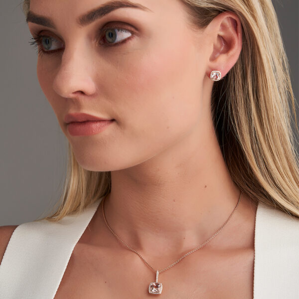 woman wearing morganite earrings and pendant
