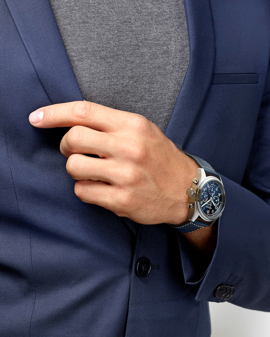 man with longines blue watch