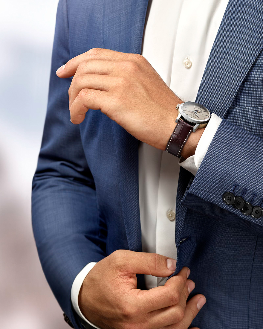 man with suit wearing watch