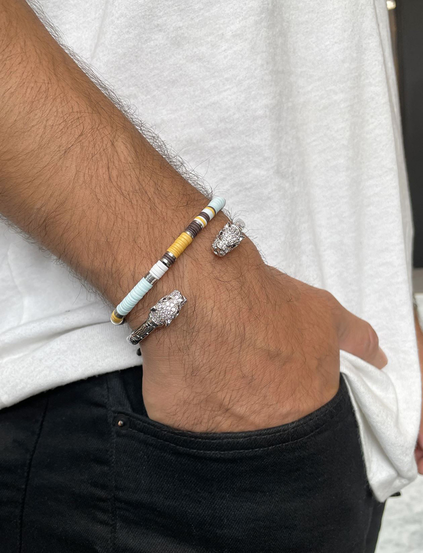 man wearing two bracelets