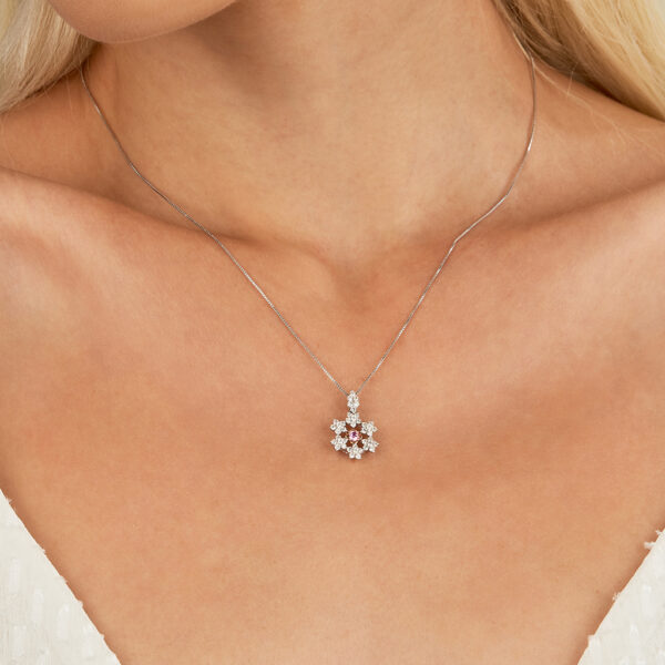 woman wearing pink diamond necklace