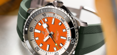 Breitling Superocean Automatic with Orange Dial and Green Rubber Strap