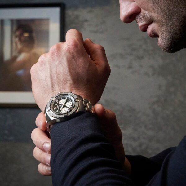 man wearing breitling avenger