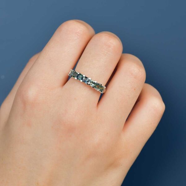 Iris ring with seven princess cut parti sapphires set on a 9k white gold band