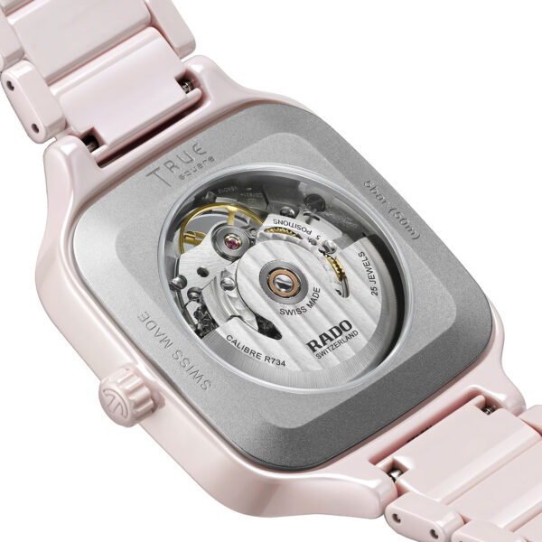 Back view of a Rado True Square Open Heart watch in rose high-tech ceramic with skeleton dial and ceramic bracelet – model R27123012