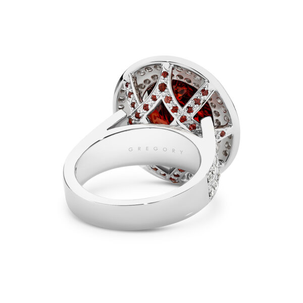 Oval shape garnet and diamond double halo cocktail ring in 18K white gold