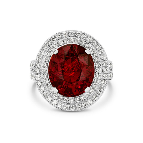 Oval shape garnet and diamond double halo cocktail ring in 18K white gold