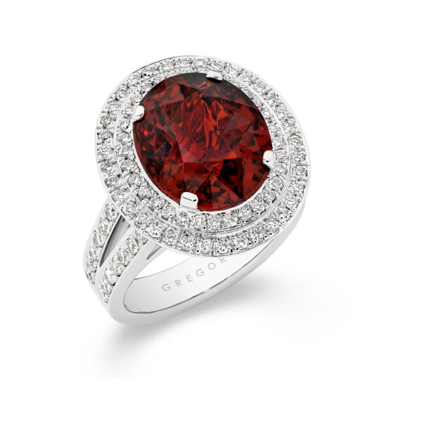 Oval shape garnet and diamond double halo cocktail ring in 18K white gold