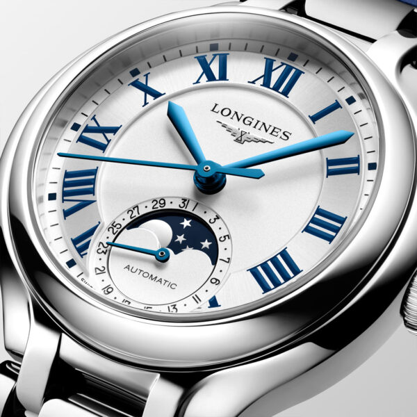 Longines Primaluna Moonphase 34mm L81264712 with ivory opaline dial, blue Roman numerals and blue alligator leather strap - close up dial
