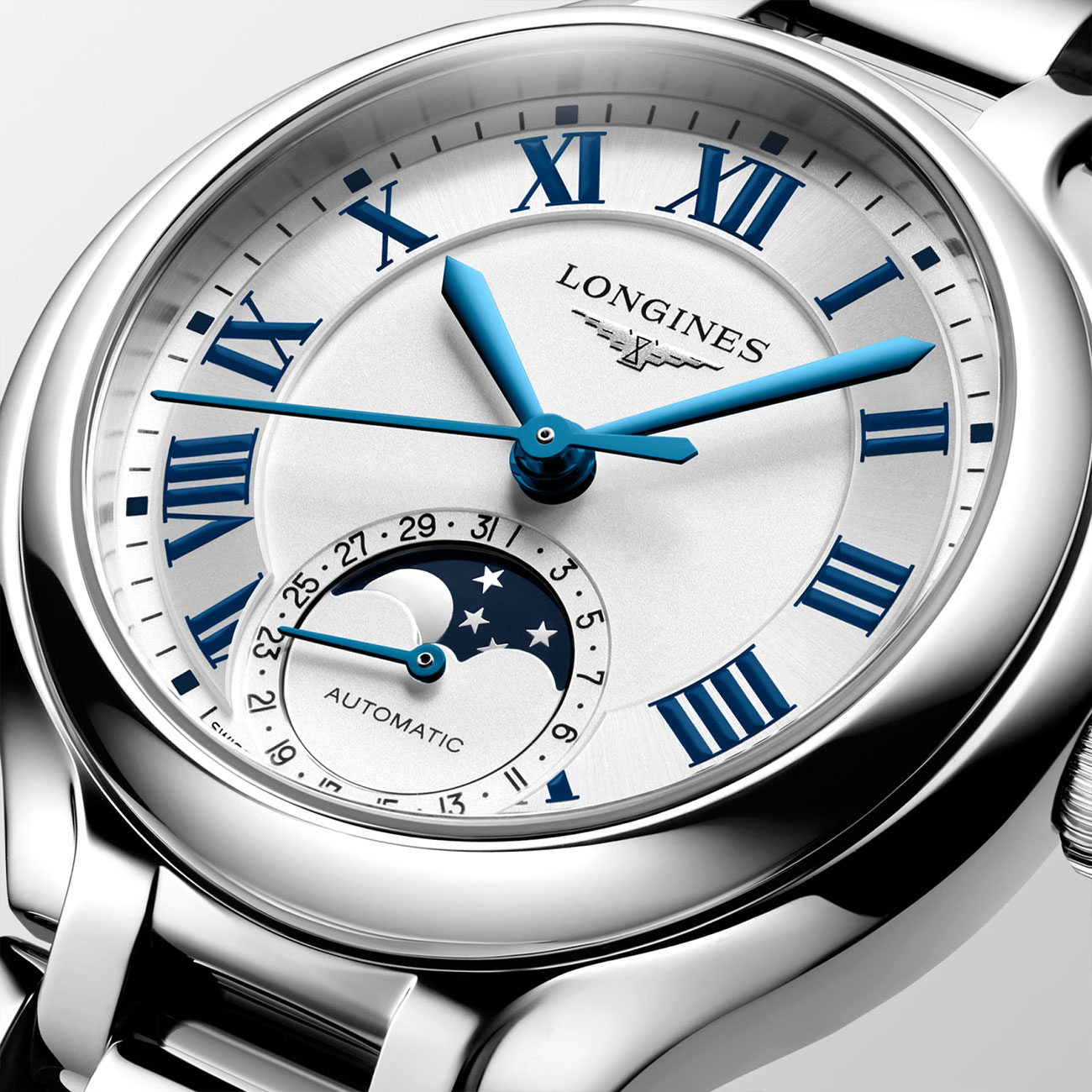 watch-collection-longines-primaluna-moonphase-l81264716-dialclose Longines Primaluna Moonphase 34mm L81264716 with ivory opaline dial, blue painted Roman numerals & stainless steel bracelet - close up dial