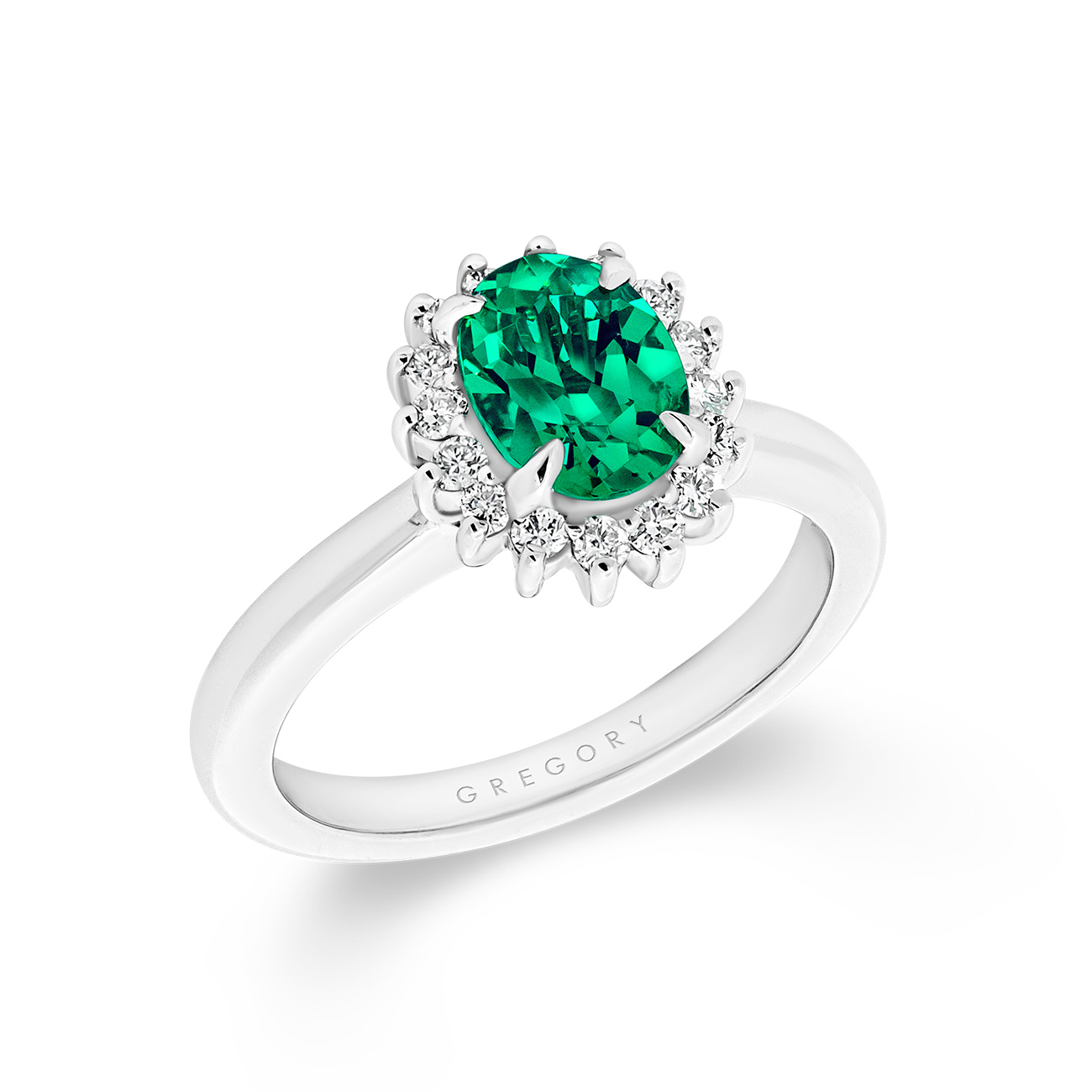 Oval Lab Emerald & Diamond Cluster Ring – 18K White Gold Oval Lab Emerald and Diamond Cluster Ring in 18K White Gold with Halo Diamonds