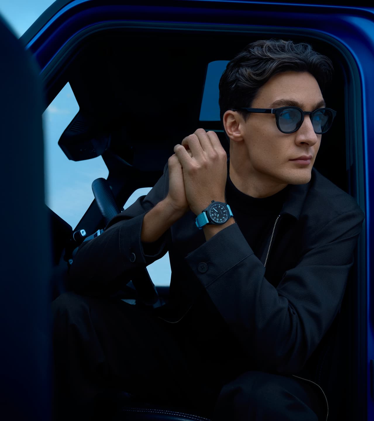 George Russell with IWC Pilot’s Watch Automatic 41 IW328107 in Car George Russell wearing IWC Pilot’s Watch Automatic 41 IW328107 sitting in car with door open