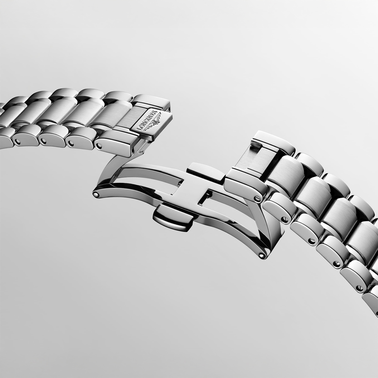 Longines Master Collection stainless steel folding clasp bracelet Close-up of Longines Master Collection stainless steel folding clasp bracelet with polished links and secure deployment clasp mechanism