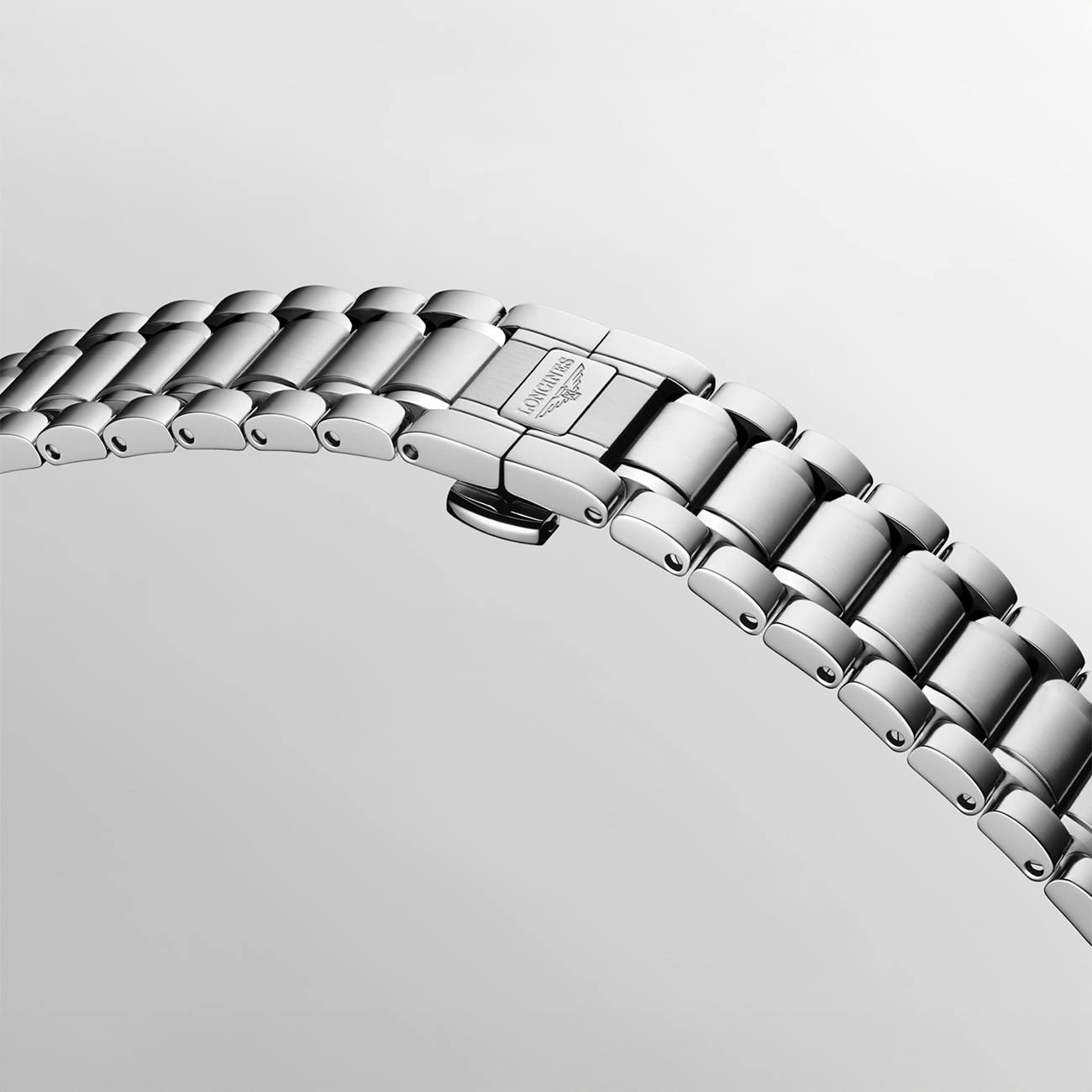 Longines Master Collection stainless steel folding clasp bracelet Close-up of Longines Master Collection stainless steel folding clasp bracelet with polished links and secure deployment clasp mechanism